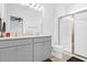 Elegant bathroom with double vanity, grey cabinets and a walk in shower at 352 Herty Park Dr, Moncks Corner, SC 29461