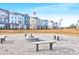 Community fire pit with benches, surrounded by townhomes at 352 Herty Park Dr, Moncks Corner, SC 29461