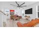 Spacious living room with hardwood floors and large TV at 352 Herty Park Dr, Moncks Corner, SC 29461