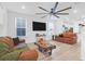Spacious living room featuring leather sofas, a large TV, and a unique coffee table at 352 Herty Park Dr, Moncks Corner, SC 29461