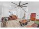 Bright and airy living room with hardwood floors and a stunning staircase at 352 Herty Park Dr, Moncks Corner, SC 29461