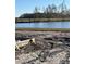 Aerial view of a new home construction site with a lake in the background at 574 Richfield Way, Summerville, SC 29486