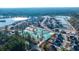 Aerial view of new homes and community with lake at 219 Darby Meadow Ln, Ridgeville, SC 29472