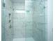 Modern bathroom with marble tile shower and glass enclosure at 219 Darby Meadow Ln, Ridgeville, SC 29472