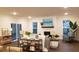 Living room with fireplace and hardwood floors, and sliding doors to patio at 219 Darby Meadow Ln, Ridgeville, SC 29472