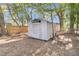 Close up view of a white metal shed in a backyard at 2208 Bailey Dr, North Charleston, SC 29405