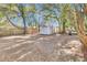White metal shed in a backyard with trees at 2208 Bailey Dr, North Charleston, SC 29405