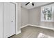 Bright bedroom with neutral walls, vinyl plank flooring, and a closet at 2208 Bailey Dr, North Charleston, SC 29405