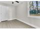 Spacious bedroom with neutral walls, vinyl plank flooring, and a closet at 2208 Bailey Dr, North Charleston, SC 29405