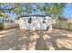 Rear view of a white house with a large backyard at 2208 Bailey Dr, North Charleston, SC 29405