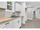 Modern kitchen features white shaker cabinets, butcher block countertops, and a farmhouse sink at 2208 Bailey Dr, North Charleston, SC 29405