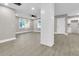 Open living space with hardwood floors and shiplap accent wall at 2208 Bailey Dr, North Charleston, SC 29405