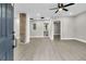 Spacious living room with hardwood floors and brick accent wall at 2208 Bailey Dr, North Charleston, SC 29405