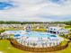 Resort-style pool with multiple sections, cabanas, and surrounding houses at 252 Watersglen Way, Summerville, SC 29486