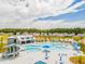 Large community pool complex with lap pool, leisure pool, and water slide at 252 Watersglen Way, Summerville, SC 29486