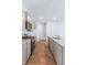 Modern kitchen with gray cabinets, granite counters, and stainless steel appliances at 252 Watersglen Way, Summerville, SC 29486