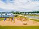 Wooden playground structure with slides, climbing wall, and picnic tables at 252 Watersglen Way, Summerville, SC 29486