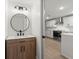 Stylish bathroom with a round mirror, modern vanity, and a white vessel sink at 31 Allway St, Charleston, SC 29403