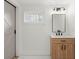 Modern bathroom vanity with a wood cabinet and black faucet at 31 Allway St, Charleston, SC 29403