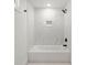 Clean bathroom with marble tile, a shower, and a white bathtub at 31 Allway St, Charleston, SC 29403