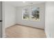 Spacious bedroom with two windows offering natural light and hardwood floors at 31 Allway St, Charleston, SC 29403