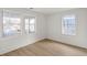 Well-lit bedroom with hardwood floors and two large windows at 31 Allway St, Charleston, SC 29403