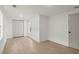 Simple bedroom with light wood flooring and double doors at 31 Allway St, Charleston, SC 29403