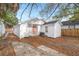 White house exterior with coral door and detached shed at 31 Allway St, Charleston, SC 29403