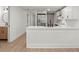 Open concept kitchen with white cabinets, stainless steel appliances and a view of the hallway at 31 Allway St, Charleston, SC 29403