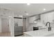 Modern kitchen with white cabinets, stainless steel appliances, and a large island at 31 Allway St, Charleston, SC 29403