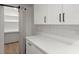 White kitchen pantry with shelving and a barn door at 31 Allway St, Charleston, SC 29403
