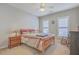 Charming bedroom with a double bed and window shutters at 506 Tranquil Waters Way, Summerville, SC 29486