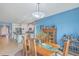 Bright dining area with a wooden table and chairs, open to kitchen at 506 Tranquil Waters Way, Summerville, SC 29486