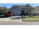 Attractive single-story home with a two-car garage and well-manicured lawn at 506 Tranquil Waters Way, Summerville, SC 29486