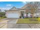 Beautiful single-story house with a landscaped yard and welcoming porch at 506 Tranquil Waters Way, Summerville, SC 29486