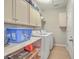 Laundry room with washer, dryer, and ample storage at 506 Tranquil Waters Way, Summerville, SC 29486