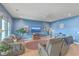 Cozy living room featuring two comfy sofas, a round rug, and a calming blue wall at 506 Tranquil Waters Way, Summerville, SC 29486