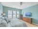 Relaxing main bedroom features a king bed, dresser, and plenty of natural light at 506 Tranquil Waters Way, Summerville, SC 29486