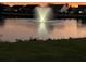 Serene pond with a fountain at sunset at 506 Tranquil Waters Way, Summerville, SC 29486
