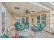 Wicker furniture and ceiling fan on a screened porch at 506 Tranquil Waters Way, Summerville, SC 29486