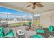 Relaxing screened porch overlooking a lake with seating at 506 Tranquil Waters Way, Summerville, SC 29486