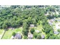 Aerial view of a house nestled in a lush, wooded area at 1633 Rose Dr, Summerville, SC 29486