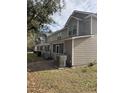 Tan siding building with screened porch at 5914 Tampa St, Hanahan, SC 29410