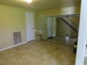 Unfinished basement with tile floors and access to stairs at 114 Berkeley Cir, Summerville, SC 29483