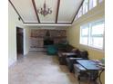 Spacious living room with tile floors, fireplace, and large windows at 114 Berkeley Cir, Summerville, SC 29483