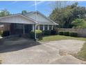 Ranch style home with carport and well-manicured lawn at 308 N Live Oak Dr, Moncks Corner, SC 29461