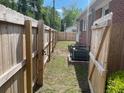 Backyard has a wooden privacy fence and a gate at 308 N Live Oak Dr, Moncks Corner, SC 29461