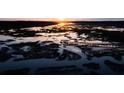 Aerial view of serene marsh at sunset with pier at 3913 Delinger Dr, Mount Pleasant, SC 29466