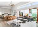 Open-concept living room and kitchen with hardwood floors and modern design at 3115 Ion Ave # D, Sullivans Island, SC 29482