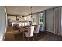 Modern kitchen with island, stainless steel appliances, and adjacent dining area at 516 Hayes Park Blvd # 1, Johns Island, SC 29455